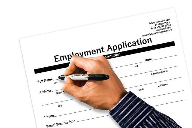 Worker signing an at-will employment application